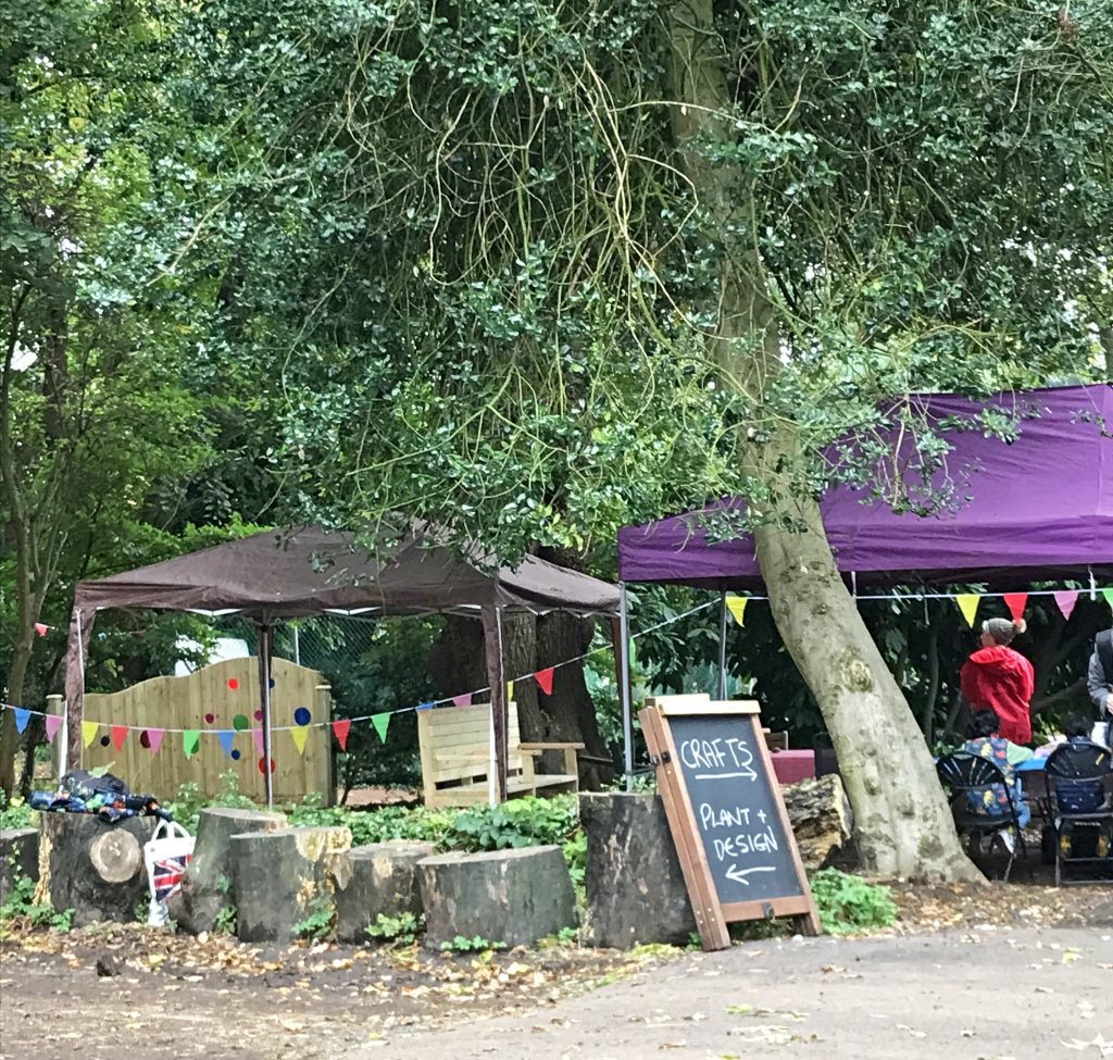 A photo of The Glade area with gazebos and bunting